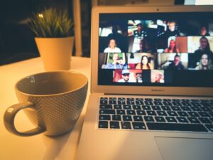 macbook air displaying woman in white shirt