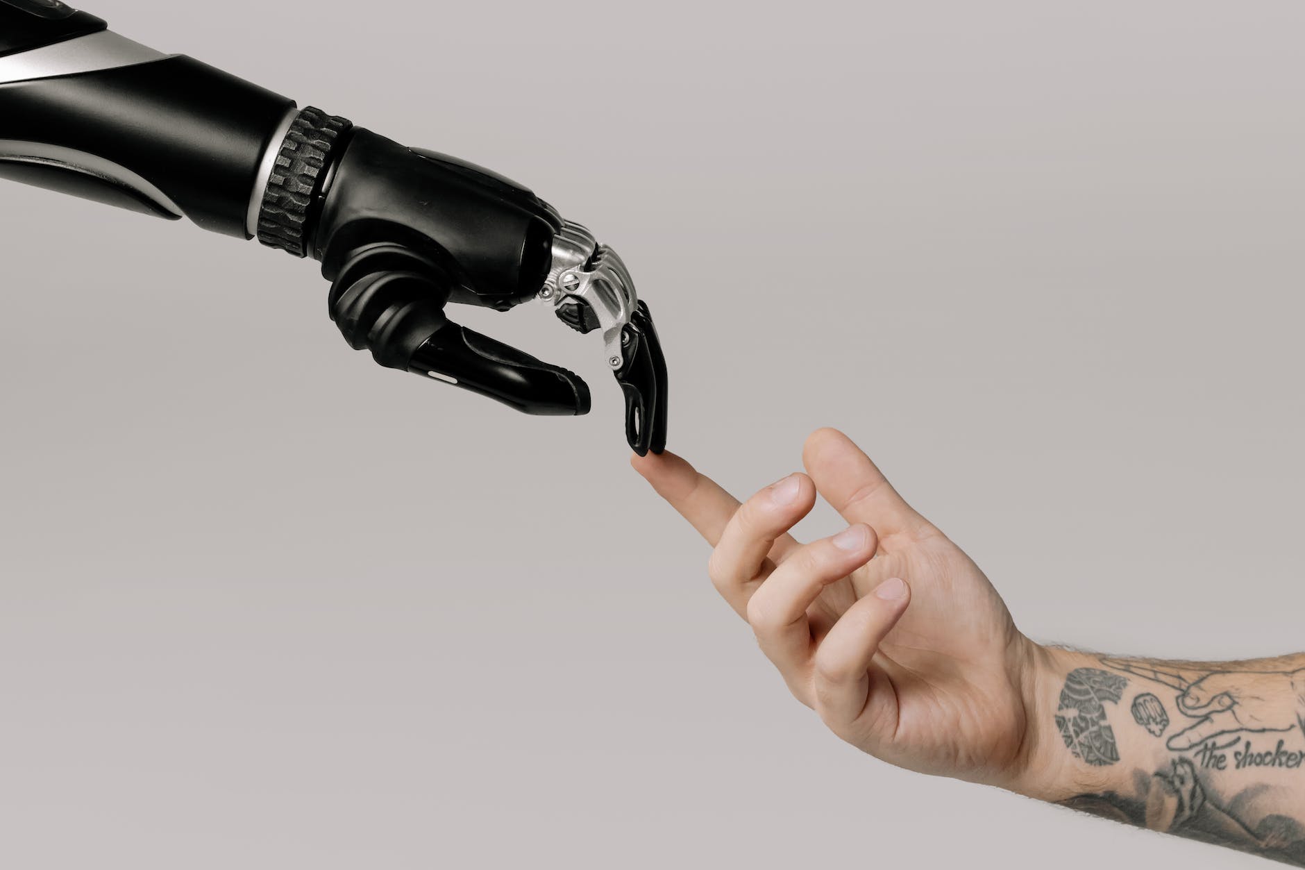 bionic hand and human hand finger pointing