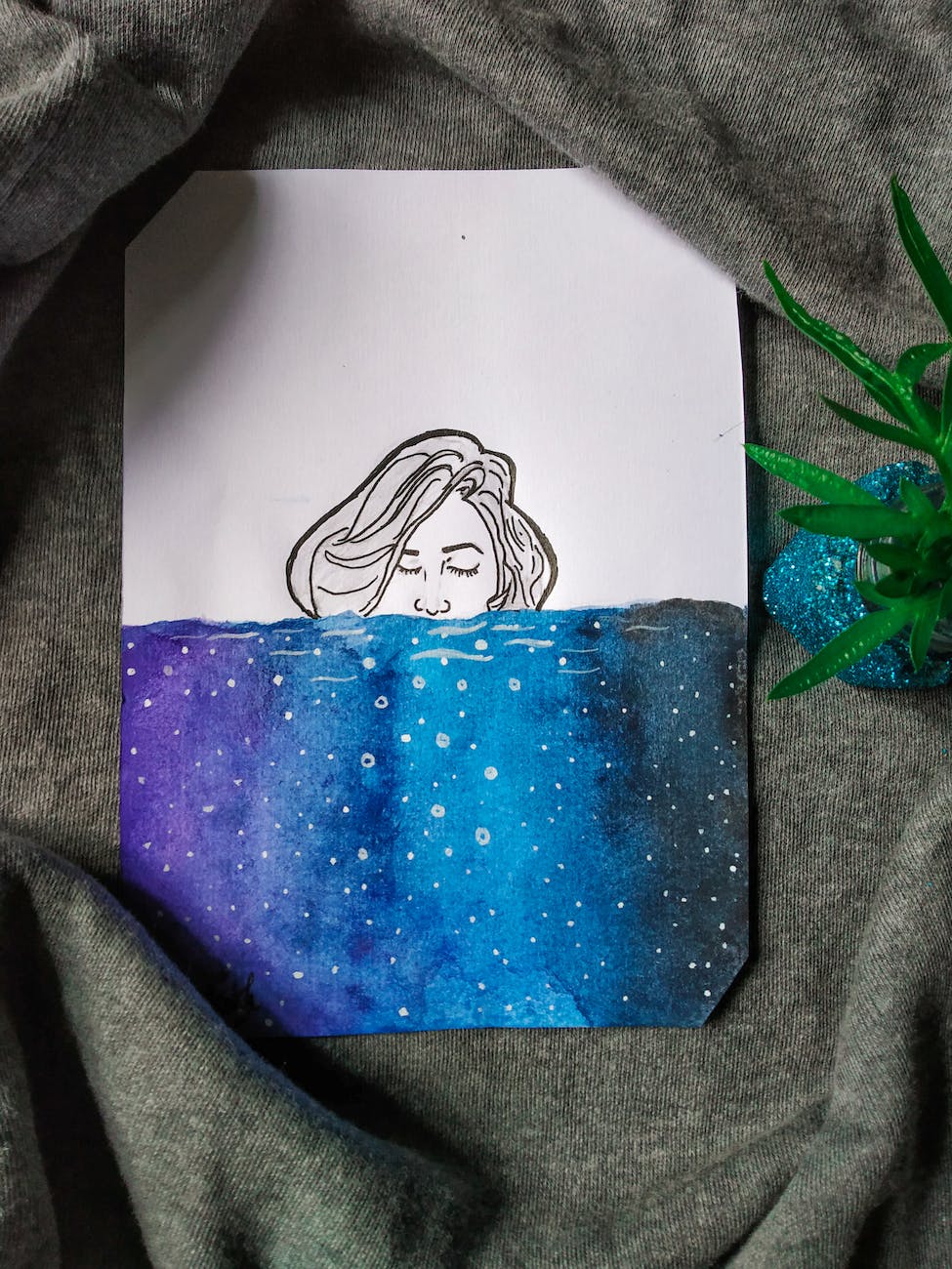 woman under water painting on gray garment